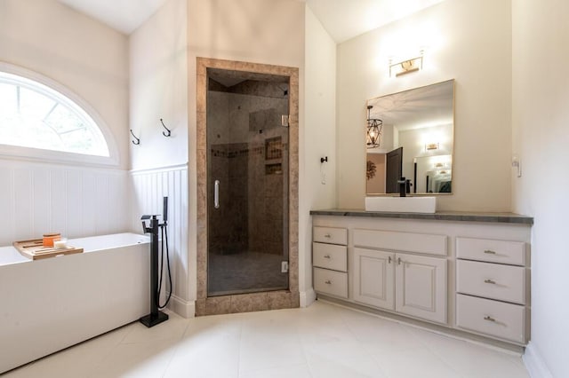 184 Deer Springs Rd, Clarks Hill, SC 29821 - bathroom featuring vanity, a freestanding bath, a wainscoted wall, a shower stall, and tile patterned flooring