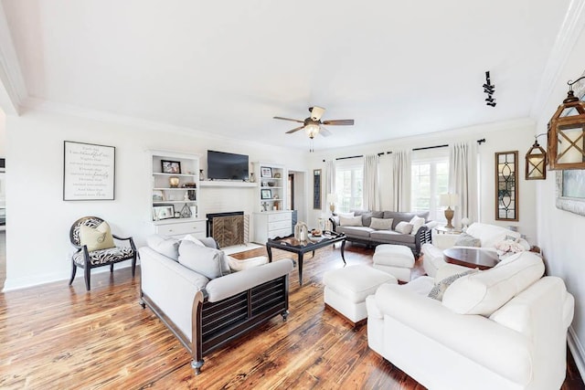 184 Deer Springs Rd, Clarks Hill, SC 29821 - living room featuring ornamental molding, ceiling fan, wood finished floors, and a fireplace with flush hearth