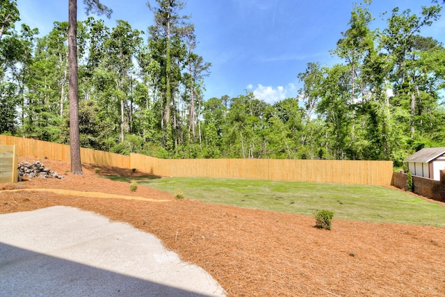 view of yard with a fenced backyard