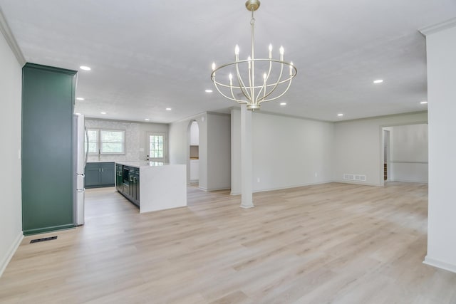 unfurnished living room with recessed lighting, arched walkways, and visible vents