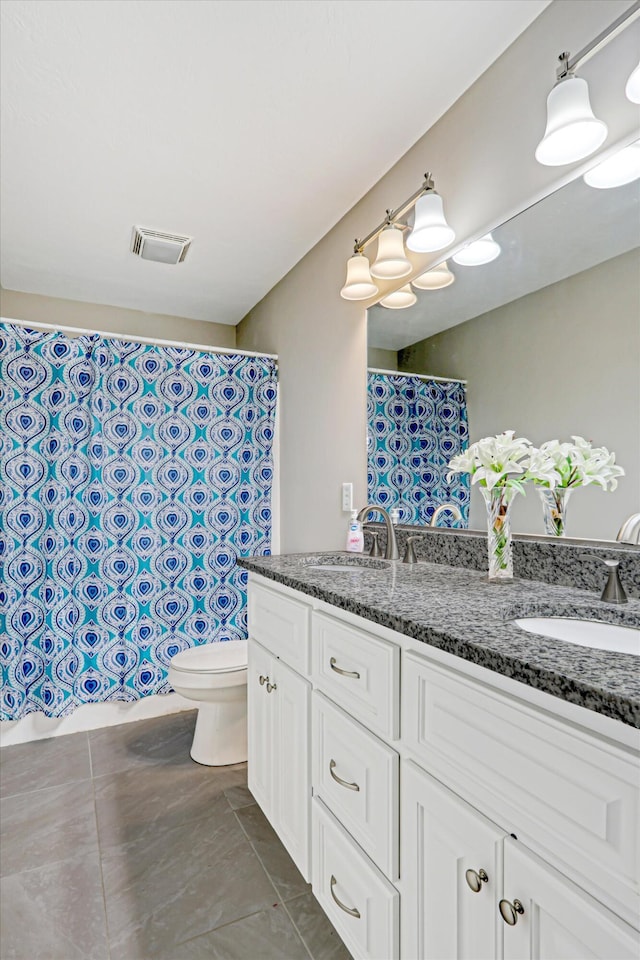 1009 Neilson St, Aiken, SC 29803 - full bath with double vanity, toilet, tile patterned floors, and a shower with shower curtain