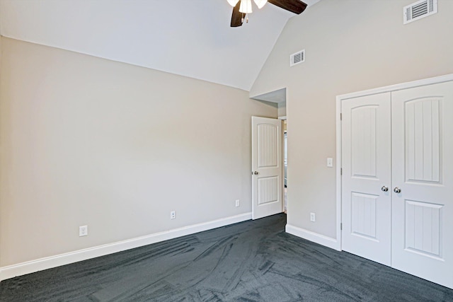1009 Neilson St, Aiken, SC 29803 - unfurnished bedroom featuring dark carpet, baseboards, a closet, a ceiling fan, and high vaulted ceiling