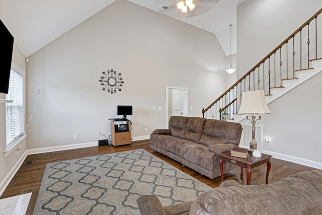 1009 Neilson St, Aiken, SC 29803 - living room featuring wood finished floors, high vaulted ceiling, stairway, ceiling fan, and baseboards