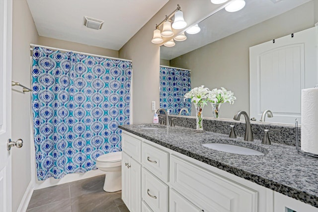 1009 Neilson St, Aiken, SC 29803 - bathroom with toilet, double vanity, curtained shower, and tile patterned floors