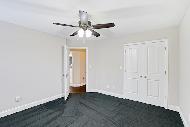 1009 Neilson St, Aiken, SC 29803 - unfurnished bedroom with dark colored carpet, baseboards, a closet, and ceiling fan