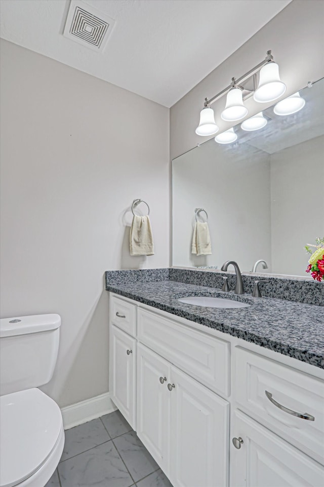 1009 Neilson St, Aiken, SC 29803 - bathroom with toilet, vanity, marble finish floors, and baseboards