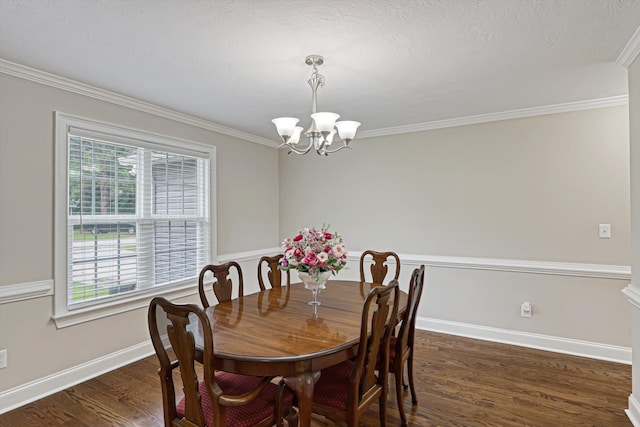 1009 Neilson St, Aiken, SC 29803 - dining room with a chandelier, dark wood-type flooring, ornamental molding, and baseboards