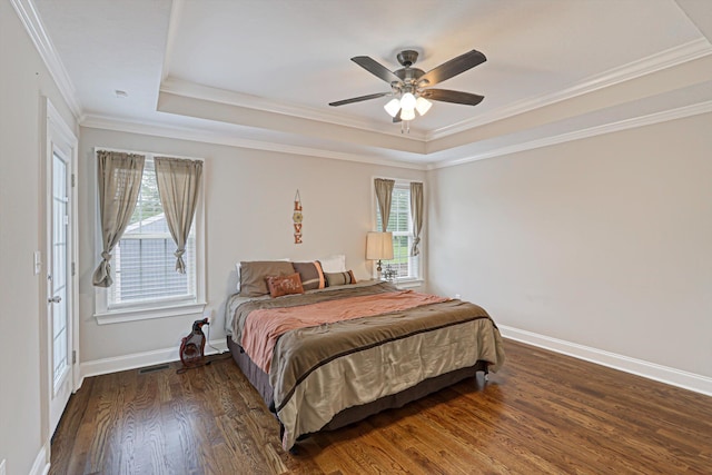 1009 Neilson St, Aiken, SC 29803 - bedroom with a raised ceiling, wood finished floors, crown molding, baseboards, and a ceiling fan