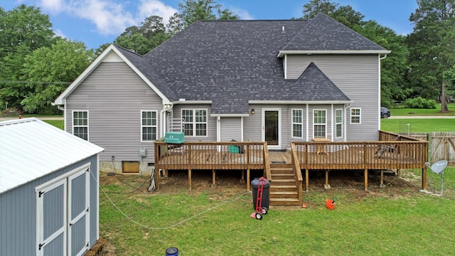 1009 Neilson St, Aiken, SC 29803 - rear view of property featuring a lawn, a shingled roof, a wooden deck, and an outdoor structure