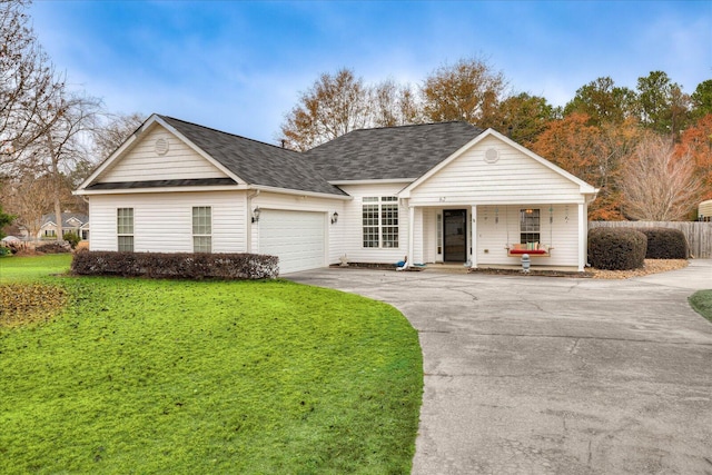 ranch-style house featuring a front lawn, covered porch, and a garage