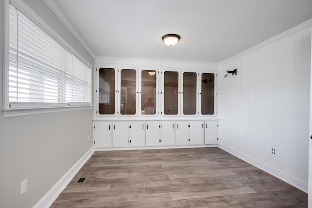 1543 Wrens Hwy, Thomson, GA 30824 - interior space featuring crown molding, baseboards, and wood finished floors