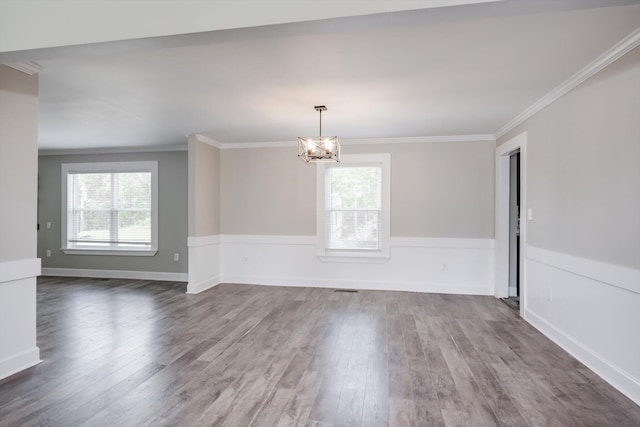 1543 Wrens Hwy, Thomson, GA 30824 - empty room with baseboards, a notable chandelier, dark wood-style floors, and ornamental molding