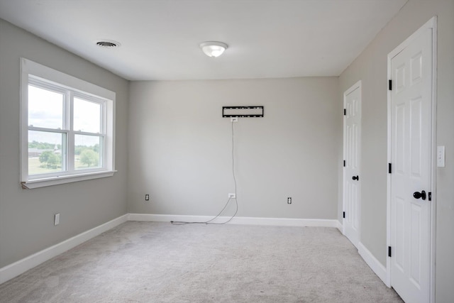 1543 Wrens Hwy, Thomson, GA 30824 - empty room featuring baseboards, visible vents, and light carpet