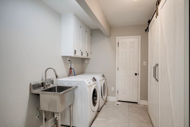 1543 Wrens Hwy, Thomson, GA 30824 - laundry room featuring separate washer and dryer, a sink, cabinet space, and baseboards