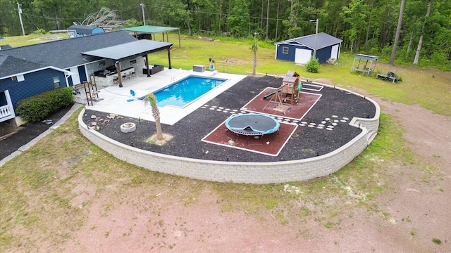 1543 Wrens Hwy, Thomson, GA 30824 - pool with a patio, an outbuilding, a playground, a yard, and a wooded view