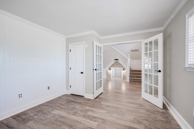 1543 Wrens Hwy, Thomson, GA 30824 - spare room featuring ornamental molding, french doors, and wood finished floors
