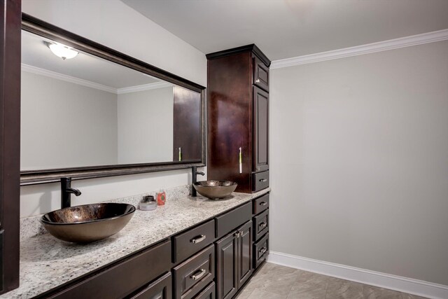 1543 Wrens Hwy, Thomson, GA 30824 - full bathroom with a sink, baseboards, ornamental molding, and double vanity