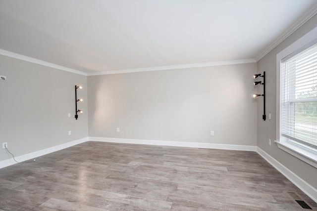 1543 Wrens Hwy, Thomson, GA 30824 - spare room featuring baseboards, ornamental molding, and wood finished floors