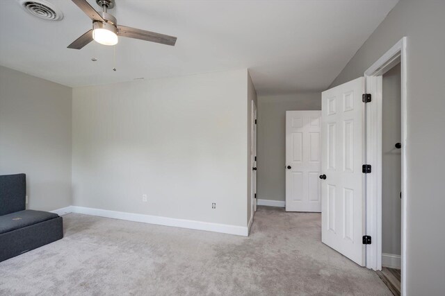 1543 Wrens Hwy, Thomson, GA 30824 - unfurnished room featuring visible vents, carpet flooring, baseboards, and a ceiling fan