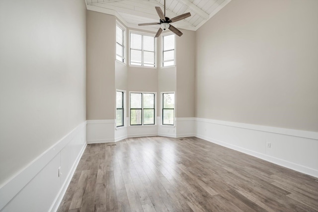 1543 Wrens Hwy, Thomson, GA 30824 - empty room with a healthy amount of sunlight, high vaulted ceiling, a ceiling fan, and wood finished floors