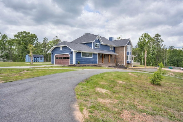 1543 Wrens Hwy, Thomson, GA 30824 - craftsman-style house with an attached garage, a front yard, and aphalt driveway