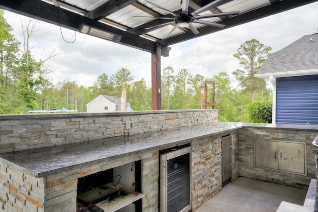 1543 Wrens Hwy, Thomson, GA 30824 - view of patio / terrace featuring wine cooler, exterior kitchen, and ceiling fan