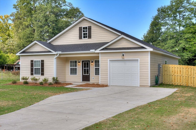 view of front facade with a front lawn, a porch, and a garage