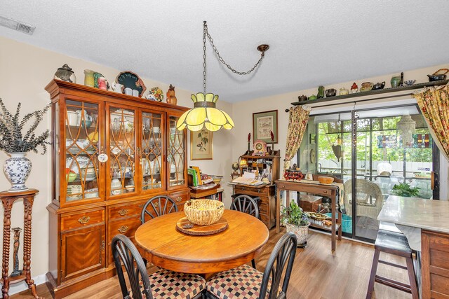 16 Cardinal Ln, North Augusta, SC 29841 - dining room with a textured ceiling and light wood-style flooring