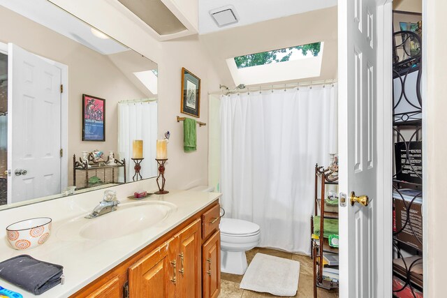 16 Cardinal Ln, North Augusta, SC 29841 - bathroom with a skylight, vanity, toilet, and curtained shower