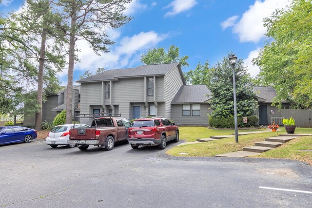 16 Cardinal Ln, North Augusta, SC 29841 - view of front facade with uncovered parking, a shingled roof, and a front yard