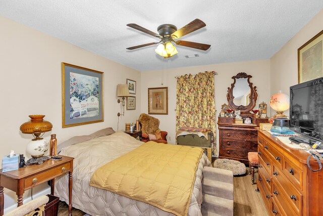 16 Cardinal Ln, North Augusta, SC 29841 - bedroom with light wood finished floors, a textured ceiling, and ceiling fan