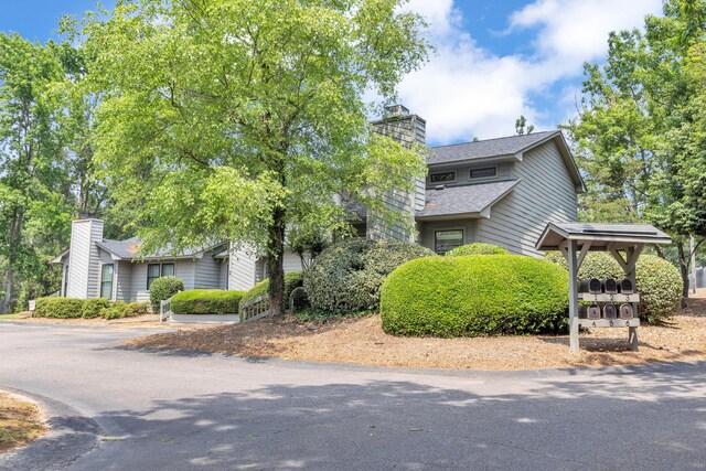 16 Cardinal Ln, North Augusta, SC 29841 - view of front of house featuring roof with shingles and a chimney