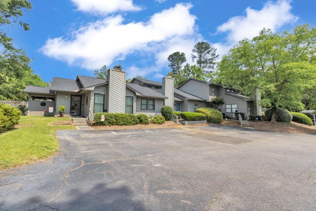 16 Cardinal Ln, North Augusta, SC 29841 - view of front facade featuring uncovered parking, a shingled roof, and a front yard