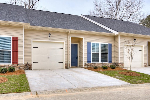 ranch-style house featuring a garage