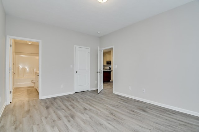 344 Bordeaux Dr, Thomson, GA 30824 - unfurnished bedroom with light hardwood / wood-style floors and ensuite bath