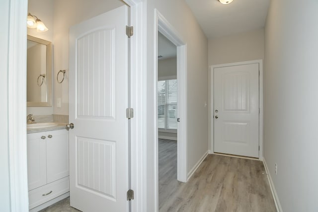 344 Bordeaux Dr, Thomson, GA 30824 - hall with sink and light hardwood / wood-style flooring
