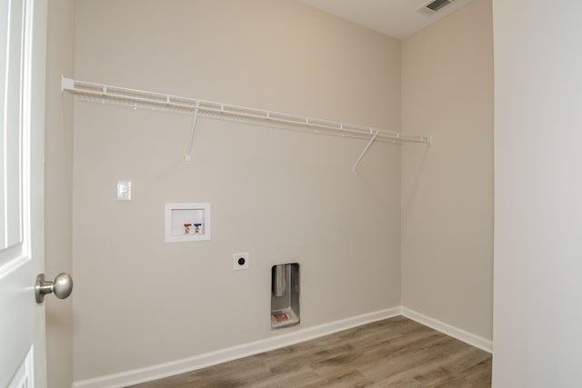344 Bordeaux Dr, Thomson, GA 30824 - laundry area featuring hardwood / wood-style floors, electric dryer hookup, and washer hookup