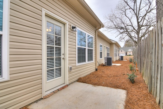 344 Bordeaux Dr, Thomson, GA 30824 - view of side of property featuring central AC unit and a patio area