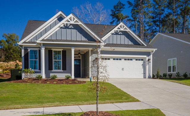 craftsman-style house featuring a front yard and a garage