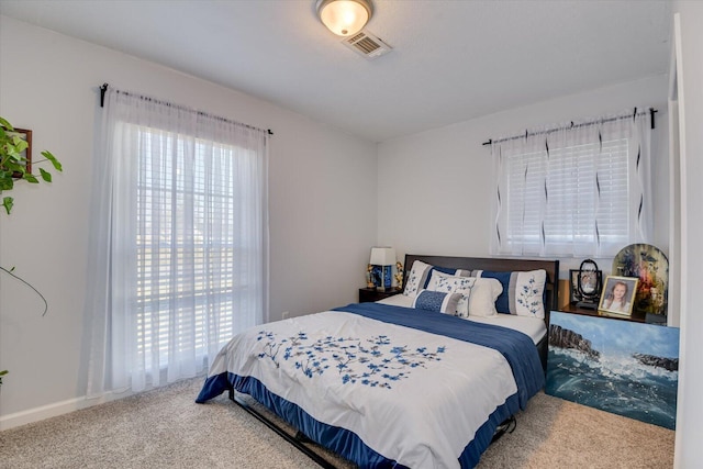 carpeted bedroom with visible vents