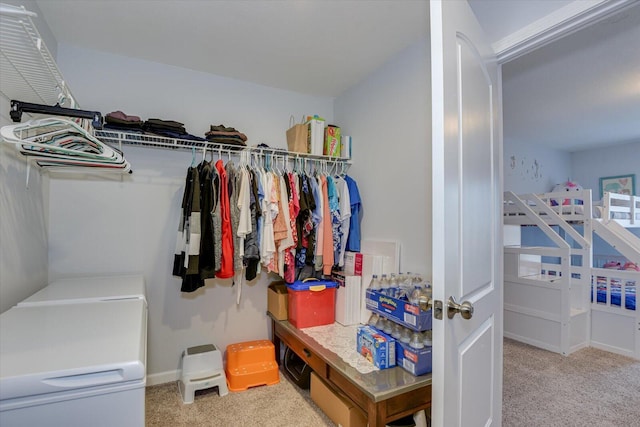 spacious closet featuring carpet flooring and independent washer and dryer