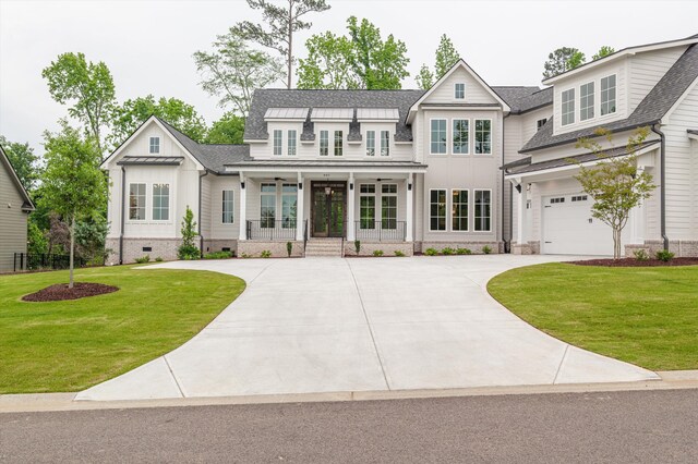845 Audubon Way, Evans, GA 30809 - view of front of house with french doors, board and batten siding, driveway, and a front yard
