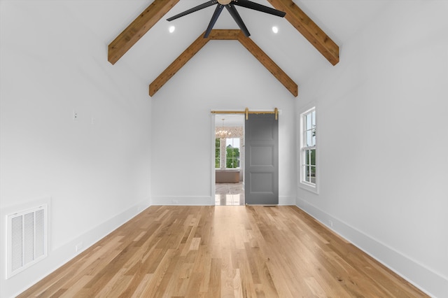 845 Audubon Way, Evans, GA 30809 - empty room with beam ceiling, a ceiling fan, high vaulted ceiling, light wood-style flooring, and baseboards