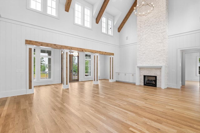 845 Audubon Way, Evans, GA 30809 - unfurnished living room with high vaulted ceiling, plenty of natural light, light wood finished floors, beamed ceiling, and a fireplace
