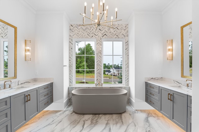 845 Audubon Way, Evans, GA 30809 - full bath featuring two vanities, marble finish flooring, crown molding, a freestanding tub, and a chandelier
