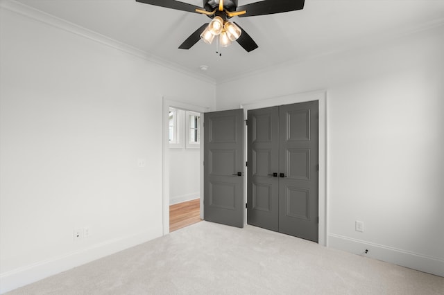 845 Audubon Way, Evans, GA 30809 - unfurnished bedroom featuring carpet floors, crown molding, a closet, ceiling fan, and baseboards
