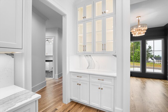 845 Audubon Way, Evans, GA 30809 - doorway featuring light wood-style flooring, a chandelier, baseboards, and crown molding