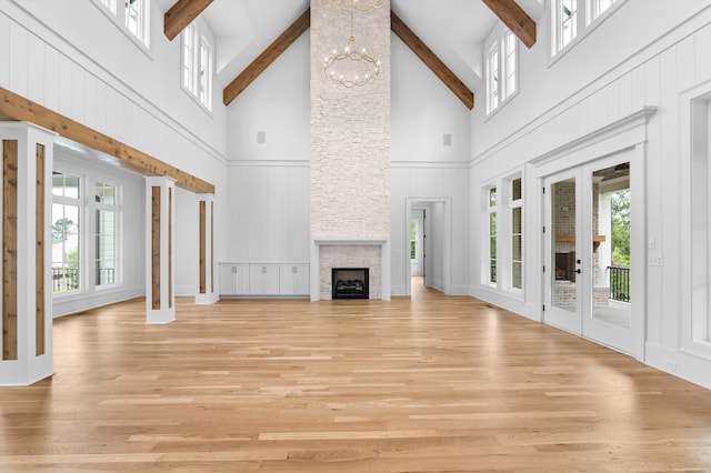 845 Audubon Way, Evans, GA 30809 - unfurnished living room featuring high vaulted ceiling, beam ceiling, plenty of natural light, a chandelier, and a decorative wall