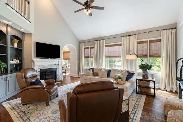 460 Armstrong Way, Evans, GA 30809 - living area with high vaulted ceiling, a tiled fireplace, plenty of natural light, a ceiling fan, and wood finished floors