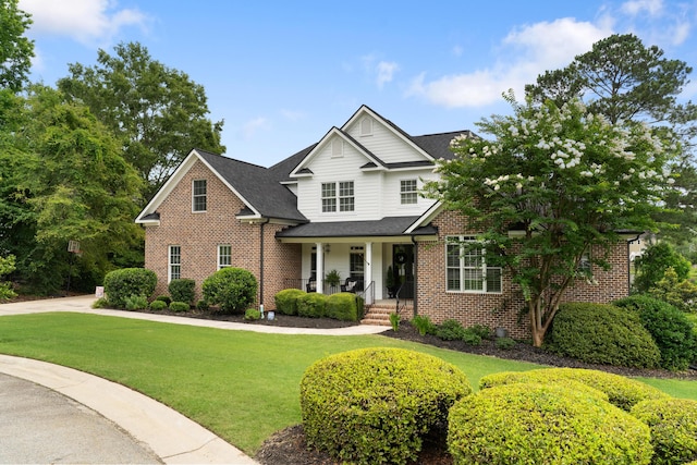 460 Armstrong Way, Evans, GA 30809 - view of front of house featuring brick siding, a porch, a front lawn, and roof with shingles
